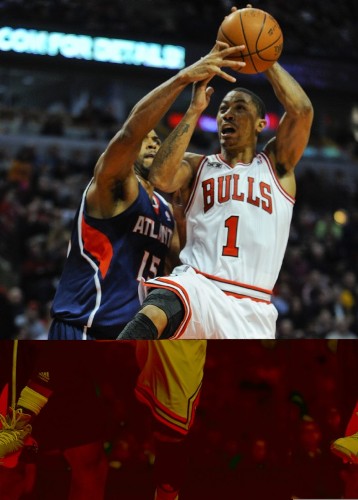 El jugador de los Bulls de Chicago, Derrick Rose (d) intenta anotar ante la marca de Al Horford (i) de los Hawks de Atlanta.