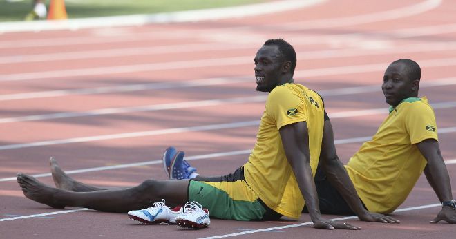 El atleta jamaicano Usain Bolt (delante) 