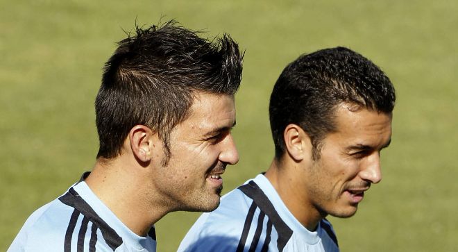 Los jugadores de la selección española de fútbol David Villa (i) y Pedro Rodríguez.
