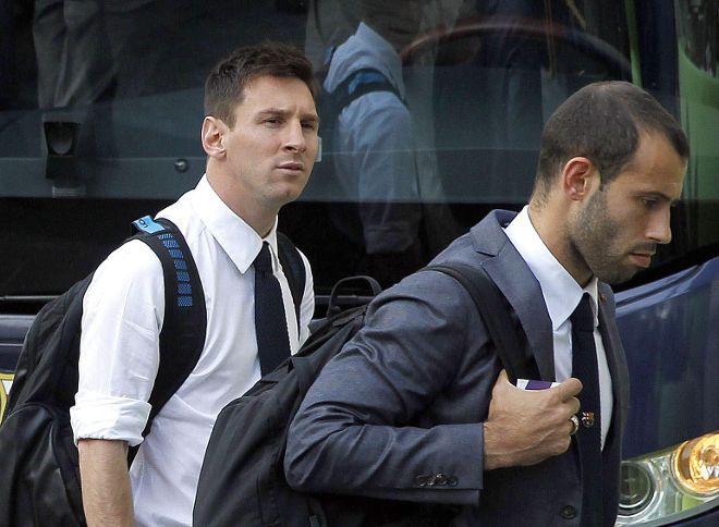 Messi y Mascherano, a su llegada a Valencia.