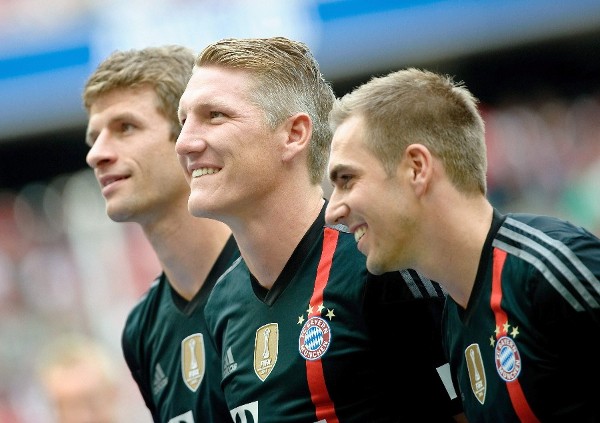 Thomas Mueller, Bastian Schweinsteiger (c) y Philipp Lahm. 