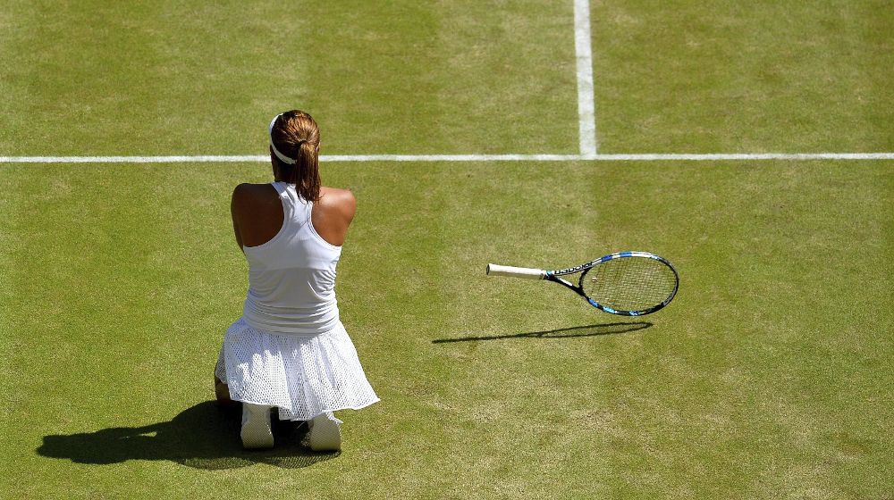 La tenista española Garbiñe Muguruza celebra su victoria ante la polaca Agnieszka Radwanska.