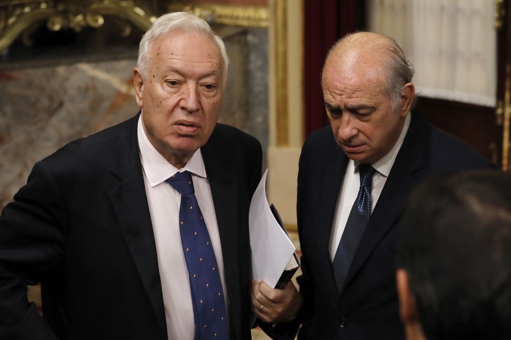 Los exministros de Asuntos Exteriores y de Cooperación José Manuel García-Margallo (i),y del Interior Jorge Fernández Díaz.