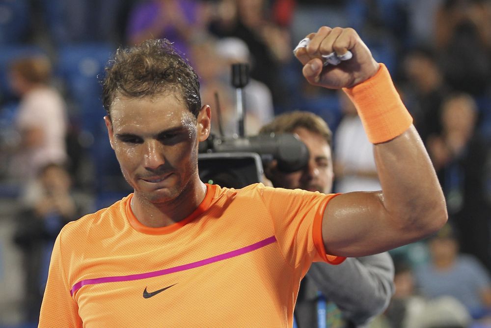 El tenista español Rafael Nadal celebra su victoria contra el canadiense Milos Raonic.
