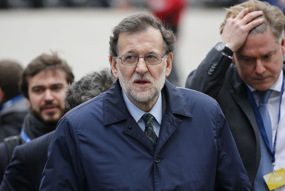 Mariano Rajoy (c).
