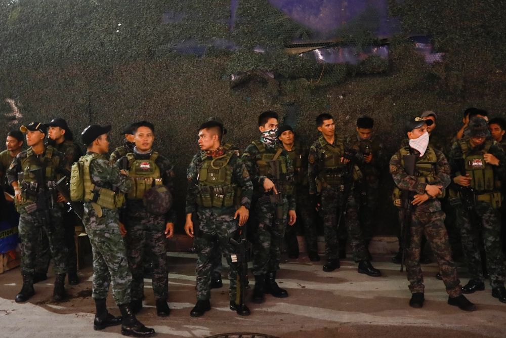 Miembros de la policía de Manila (Filipinas). 