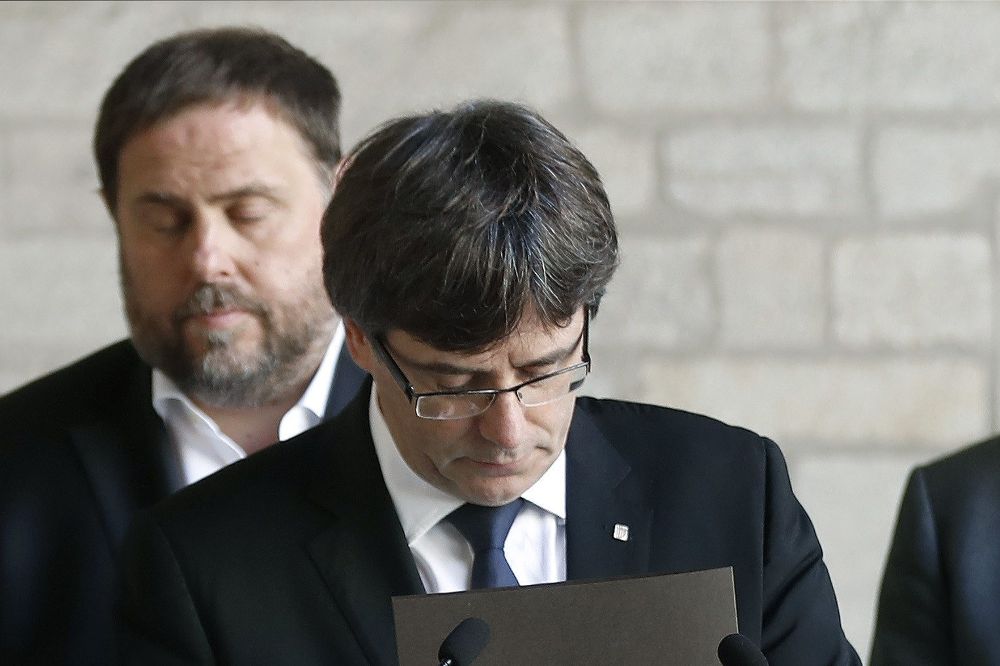 El presidente de la Generalitat, Carles Puigdemont, y su vicepresidente Oriol Junqueras.