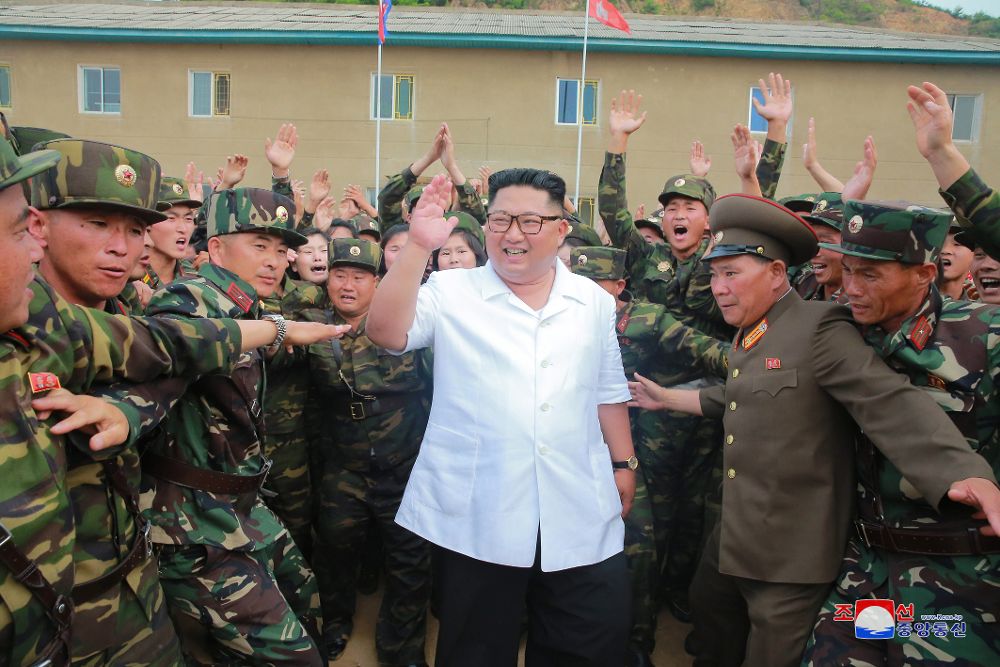 Kim Jong-un (C).