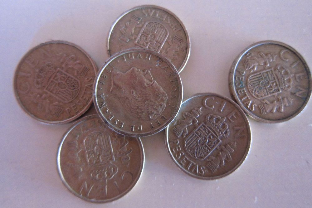 Monedas de cien pesetas.