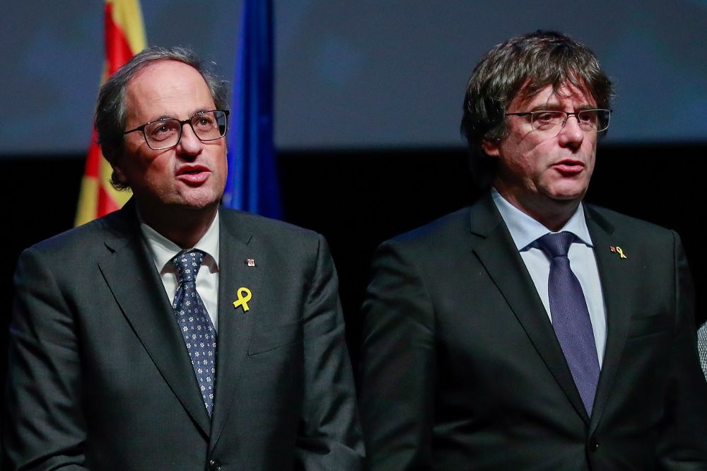 Carles Puigdemont (d) y Quim Torra.